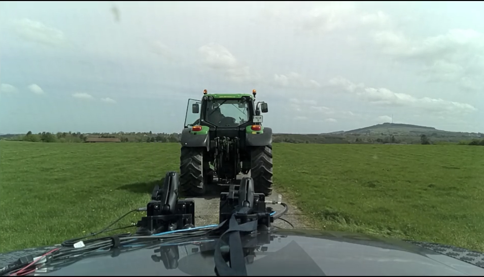 Camera view of the scene: a tractor in a field